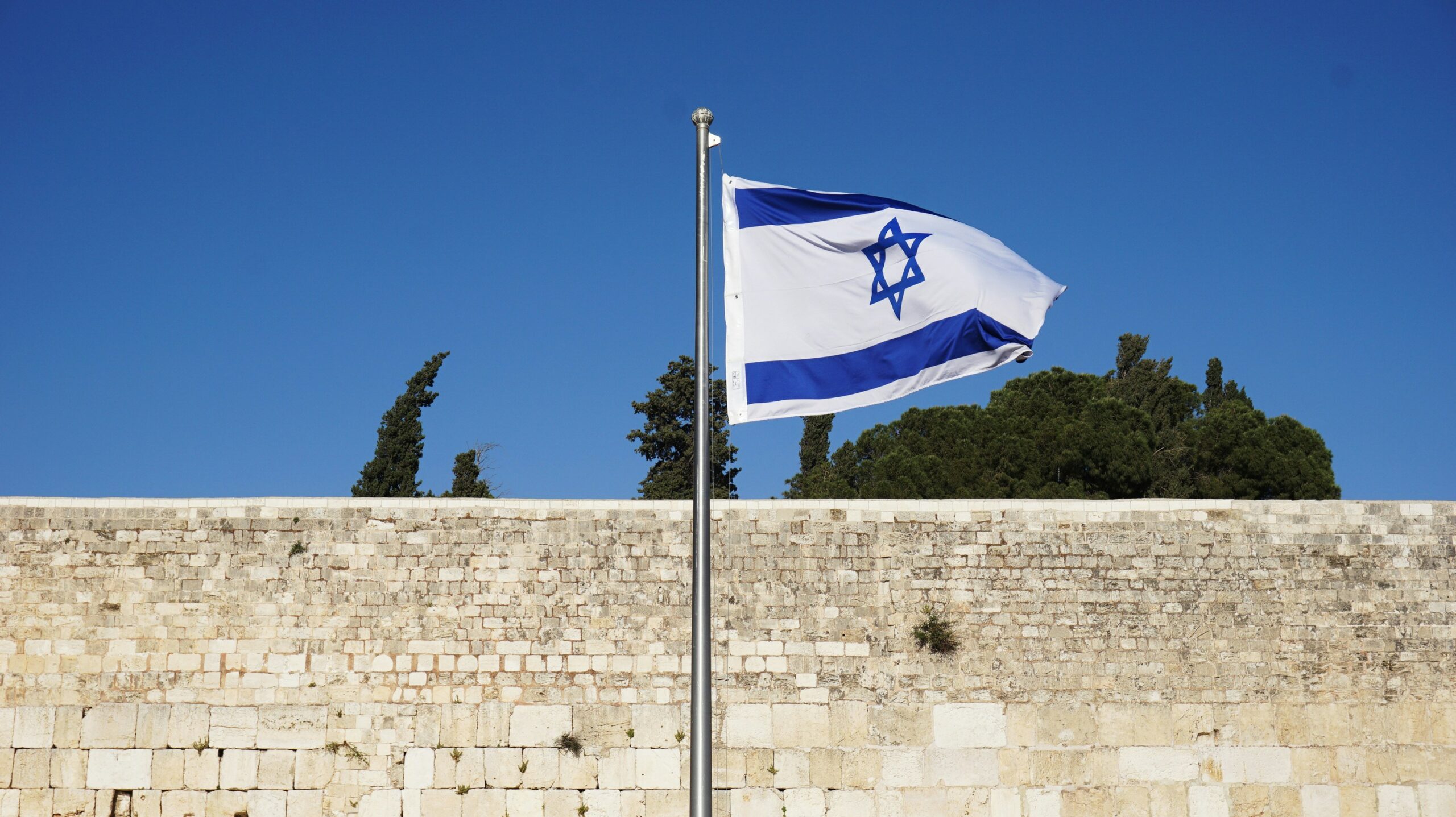 Israel flag representing the country's economic resiliance under geopolitical tensions.