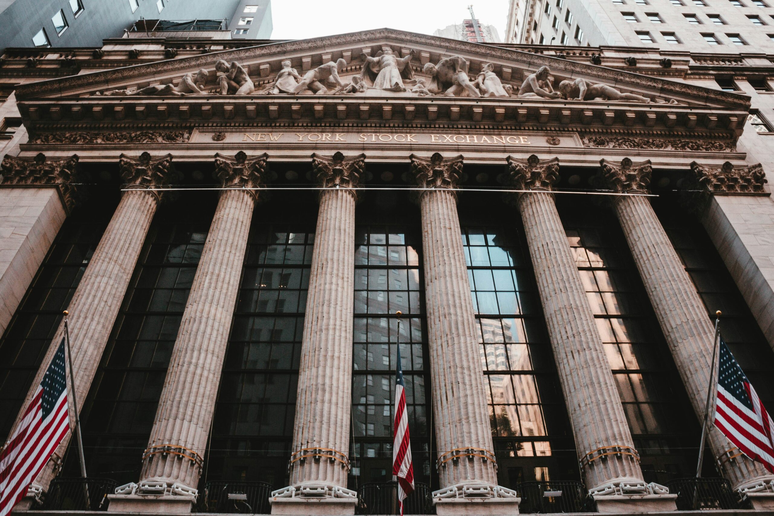 New York Stock Exchange building facade on Wall Street, home to many of the world's largest publicly traded companies