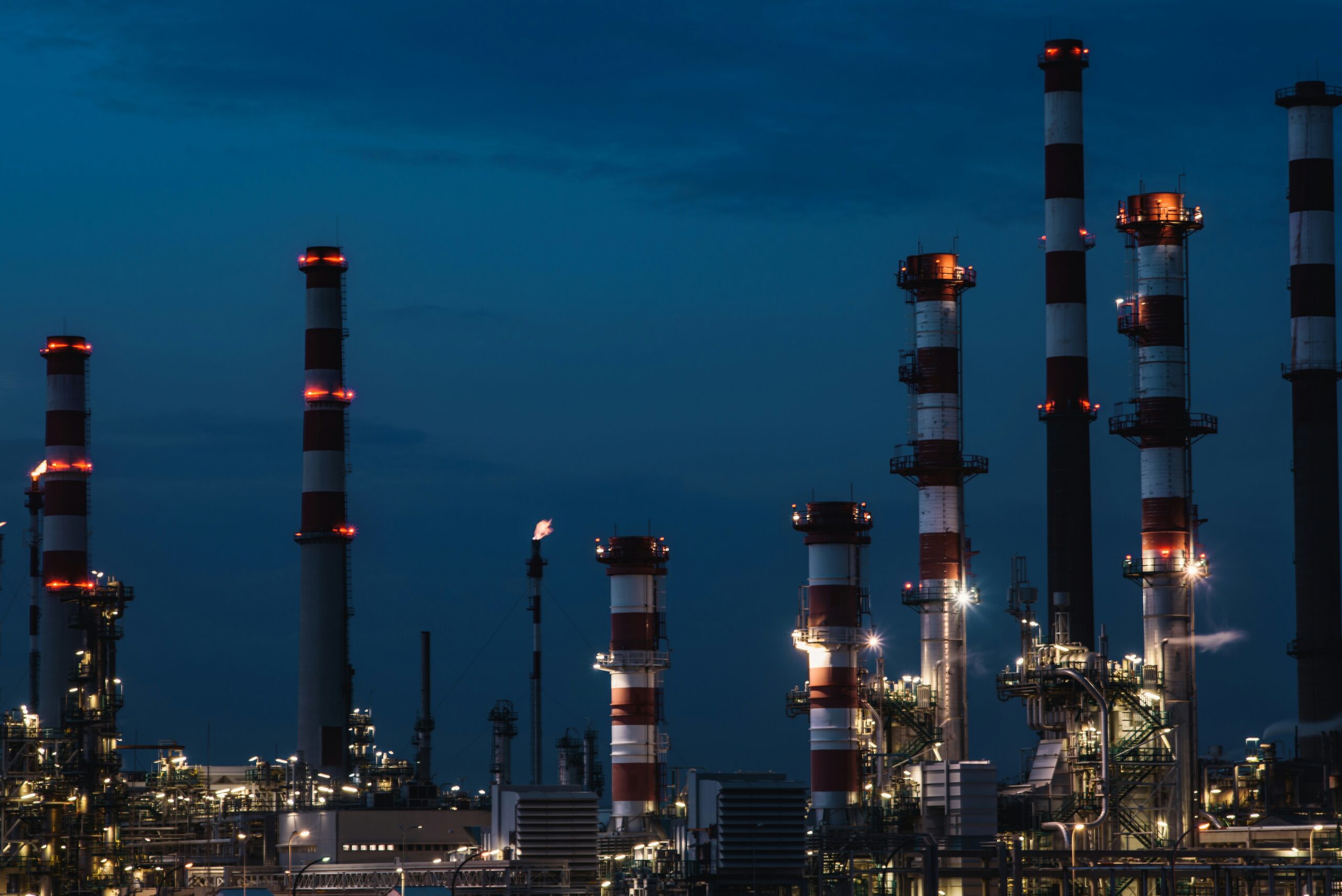 Oil refinery displaying how iran sanctions and blockades affect global chains.